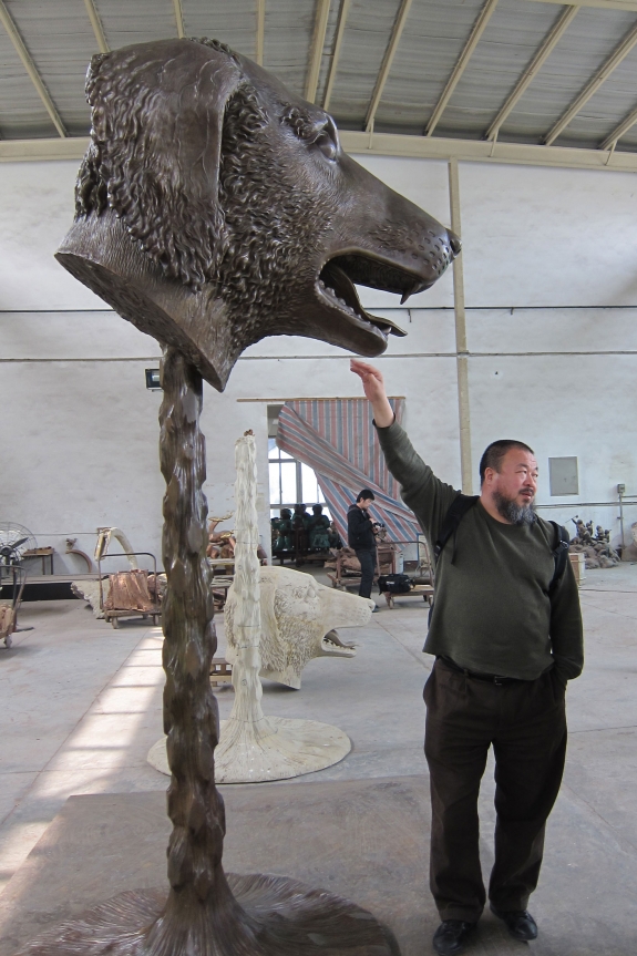 Ai Weiwei with one of the bronze animals from &#039;Zodiac Heads.&#039;