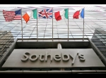 Flags fly outside Sotheby&#039;s in New York. 