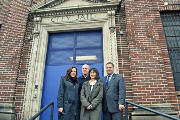 Yonkers Deputy Mayor Susan Gerry, left, with art dealer Daniel Wolf, artist Maya Lin and Mayor Mike Spano on the steps of Yonkers City Jail. 