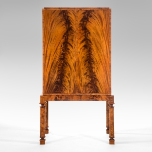 A Swedish Grace Period Flame Mahogany Cabinet on Stand, c. 1930. 
