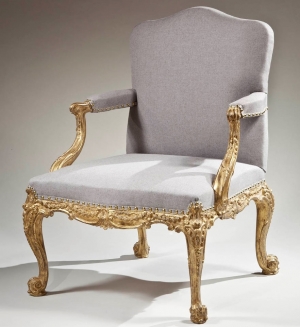     A fine carved and gilded open armchair. Height: 39 ½,” Seat Height: 17,” Width: 28,” Depth: 28 ¼,” English, circa 1765. Courtesy of Clinton Howell Antiques.