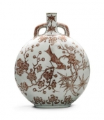 A rare underglaze-red &quot;magpie and prunus&quot; moonflask Qianlong seal mark and period. Estimate: £300,000-500,000.