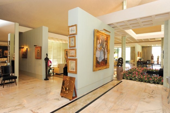 Walter and Leonore Annenberg used the space in their Rancho Mirage residence to maximum effect in showcasing their art collection. Featured here is The Daughters of Catulle Mendès, 1888, by Auguste Renoir, which was donated to the Metropolitan Museum of Art. The wall reserved for that oil-on-canvas painting is flanked by two sculptures by Jean Arp: (left) Configuration: Souvenir d’Athenes (Souvenir of Athens), 1955, bronze, edition 2/3, purchased directly from the artist and signed and dedicated to Walter Annenberg on verso; and (right) Simplicité Sinueuse (Entangled Simplicity), 1960, bronze with Arp base in stone, edition 1/5.
