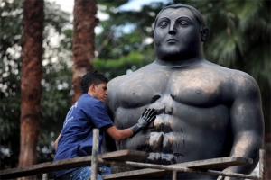 A restoration of a sculpture by Fernando Botero in Medellin, Colombia.