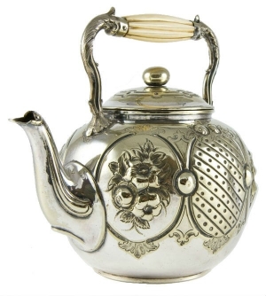 Antique Victorian brass teapot with carved ivory handle.