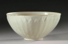 The rare "Ding" ware bowl that sold at Sotheby's for $2.2 million was originally bought at a garage sale for $3.