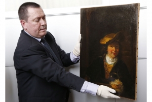 Colonel Stephane Gauffeny presents Rembrandt&#039;s &#039;Child with a Soap Bubble,&#039; to the press.