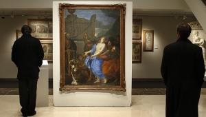 Visitors view the Charles Le Brun painting that was found at the Ritz in Paris while it was on view at Christie&#039;s in January 2013.